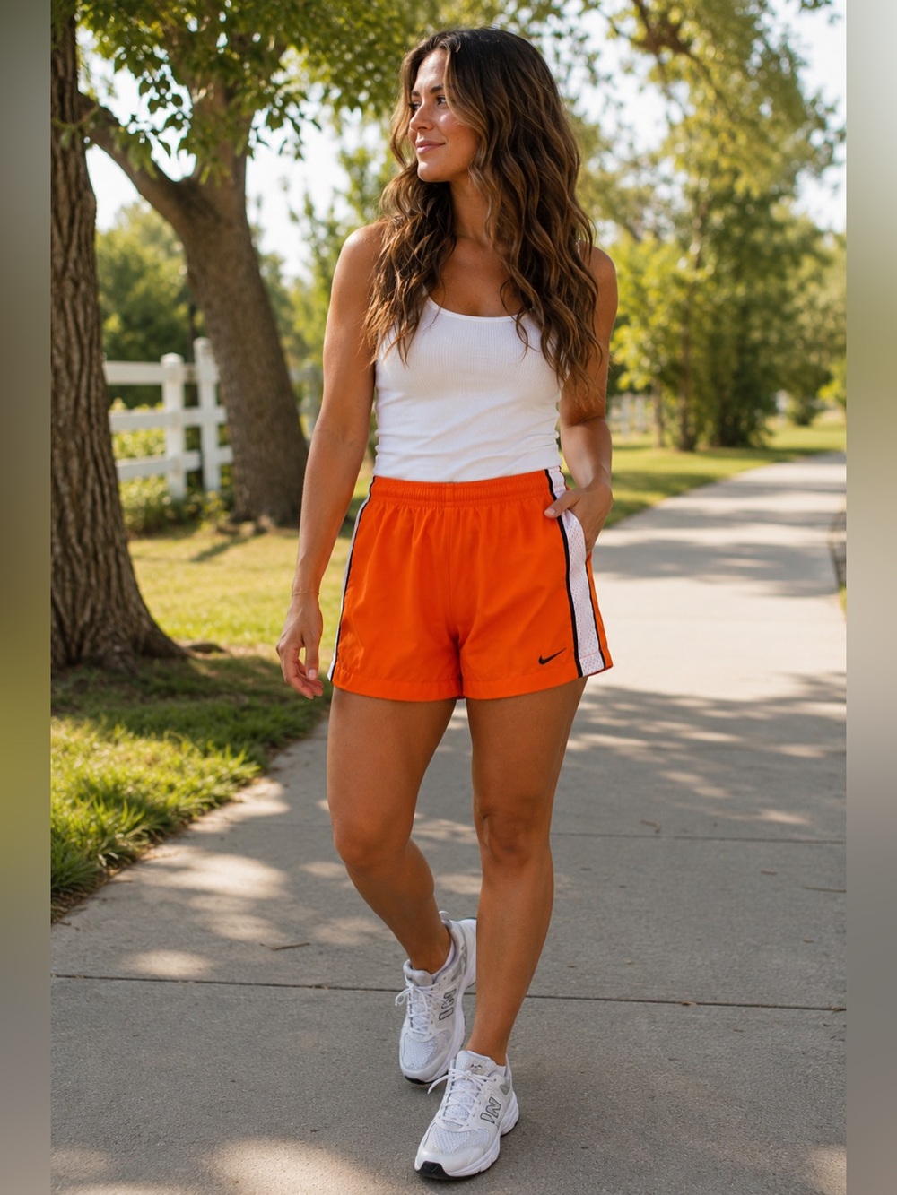 Nike Orange Athletic Shorts with White Mesh Sides and Black Trim